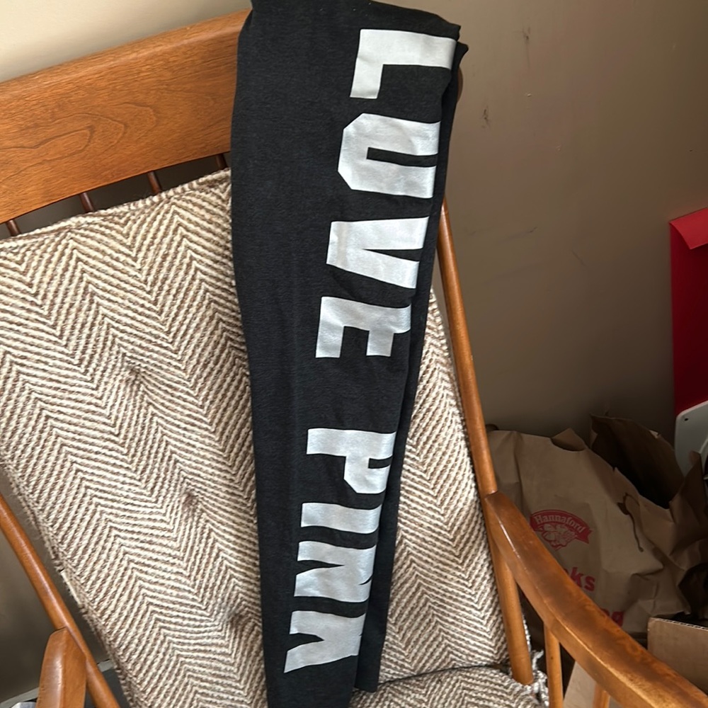 Size medium vs pink leggings with silver logo